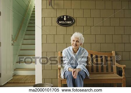 Senior woman smiling on the porch View Large Photo Image Stock Photography - Senior woman smiling on the porch. Fotosearch