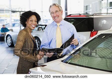 Woman buying a car View Large Photo Image Stock Image - Woman buying a car. Fotosearch
