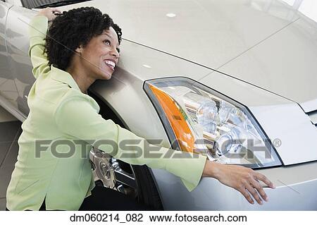 Woman hugging her car View Large Photo Image Stock Image - Woman hugging her car. Fotosearch