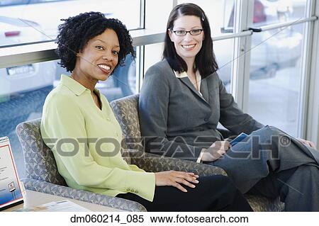 Stock Photography - Women smiling together. Fotosearch