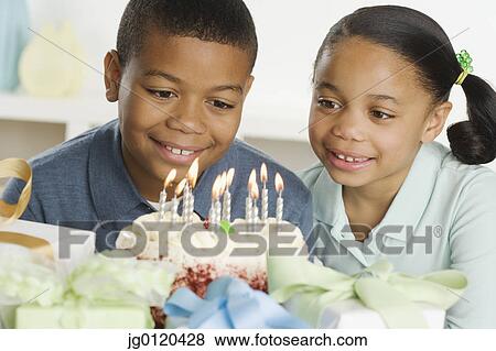 Stock Photo - Young boy celebrating his birthday. Fotosearch