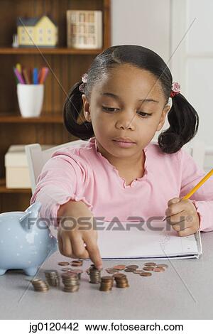 Young girl counting coins View Large Photo Image Stock Image - Young girl counting coins. Fotosearch
