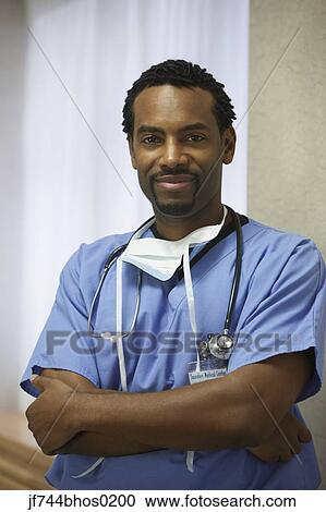 African male surgeon with arms crossed View Large Photo Image Stock Image - African male surgeon with arms crossed. Fotosearch