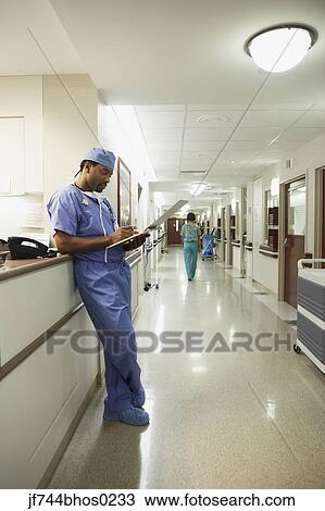 African male surgeon writing in chart, Bethesda, Maryland, United States View Large Photo Image Stock Image - African male surgeon writing in chart, Bethesda, Maryland, United States. Fotosearch