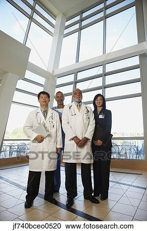 Businesswoman standing with doctors, North Bethesda, Maryland, United States View Large Photo Image Stock Image - Businesswoman standing with doctors, North Bethesda, Maryland, United States. Fotosearch