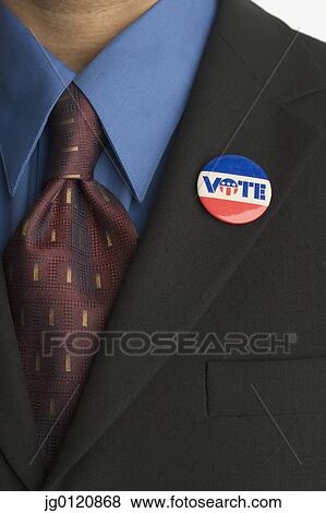 Close up of businessman with vote pin on lapel View Large Photo Image Stock Photo - Close up of businessman with vote pin on lapel. Fotosearch