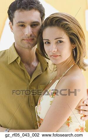 Close up of couple hugging View Large Photo Image Stock Image - Close up of couple hugging. Fotosearch