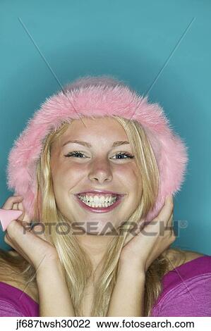 Close up of girl wearing pink hat and smiling View Large Photo Image Stock Image - Close up of girl wearing pink hat and smiling. Fotosearch