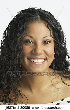 Stock Photography - Close up of young Hispanic woman smiling. Fotosearch