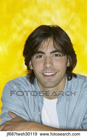 Close up of young man smiling View Large Photo Image Stock Photo - Close up of young man smiling. Fotosearch