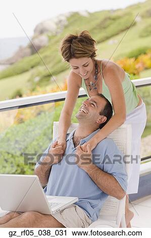 Couple hugging on balcony, Florianopolis, Brazil View Large Photo Image Stock Image - Couple hugging on balcony, Florianopolis, Brazil. Fotosearch