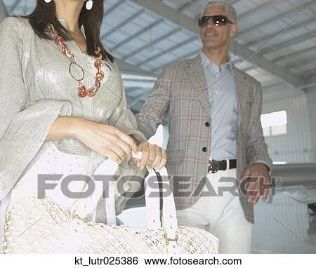 Couple in airplane hanger, Nobato, California, United States View Large Photo Image Stock Photograph - Couple in airplane hanger, Nobato, California, United States. Fotosearch