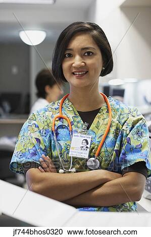 Stock Image - Female nurse smiling. Fotosearch