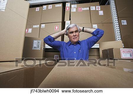 Frustrated businessman in warehouse View Large Photo Image Picture - Frustrated businessman in warehouse . Fotosearch