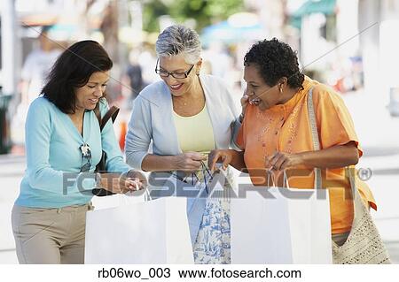 Group of middle-aged woman with shopping bags, Miami, Florida, United States View Large Photo Image Stock Image - Group of middle-aged woman with shopping bags, Miami, Florida, United States. Fotosearch