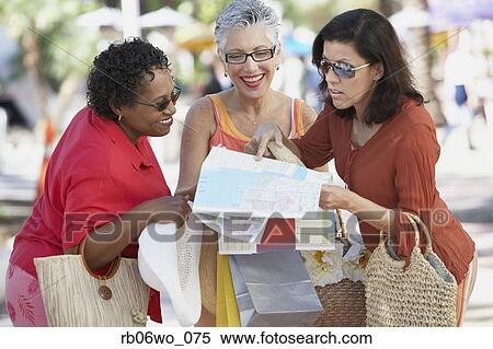 Group of middle-aged women looking at a map, Miami, Florida, United States View Large Photo Image Stock Photography - Group of middle-aged women looking at a map, Miami, Florida, United States. Fotosearch