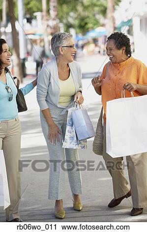 Group of middle-aged women with shopping bags, Miami, Florida, United States View Large Photo Image Stock Image - Group of middle-aged women with shopping bags, Miami, Florida, United States. Fotosearch