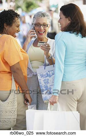 Stock Photography - Group of middle-aged women with shopping bags, Miami, Florida, United States. Fotosearch