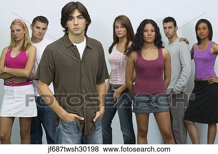 Stock Photo - Group of young people looking serious. Fotosearch