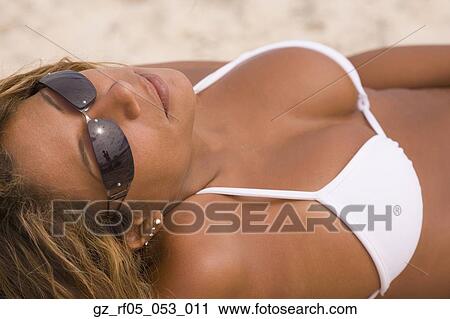 Hispanic woman in bathing suit tanning View Large Photo Image Stock Image - Hispanic woman in bathing suit tanning. Fotosearch