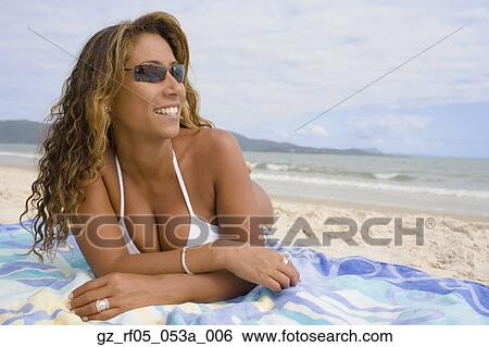Hispanic woman lying on the beach, Florianopolis, Brazil View Large Photo Image Stock Photograph - Hispanic woman lying on the beach, Florianopolis, Brazil. Fotosearch