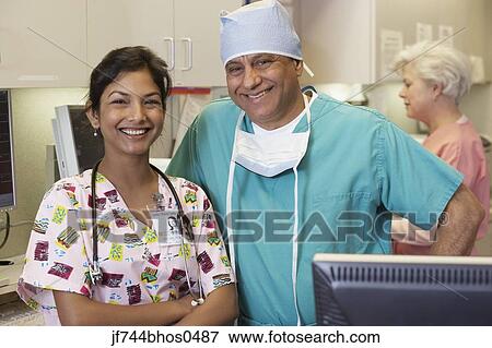 Stock Photo - Indian male surgeon and Indian female nurse, Bethesda, Maryland, United States. Fotosearch