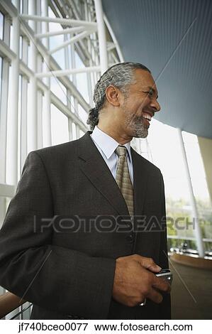Middle-aged African businessman smiling, North Bethesda, Maryland, United States View Large Photo Image Stock Photo - Middle-aged African businessman smiling, North Bethesda, Maryland, United States. Fotosearch
