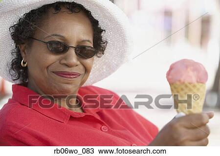 Middle-aged African woman with ice cream cone, Miami, Florida, United States View Large Photo Image Stock Image - Middle-aged African woman with ice cream cone, Miami, Florida, United States. Fotosearch