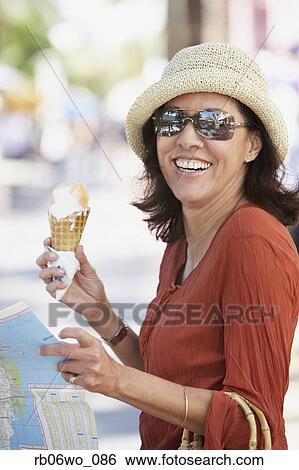 Middle-aged Hispanic woman with ice cream cone, Miami, Florida, United States View Large Photo Image Stock Photograph - Middle-aged Hispanic woman with ice cream cone, Miami, Florida, United States. Fotosearch