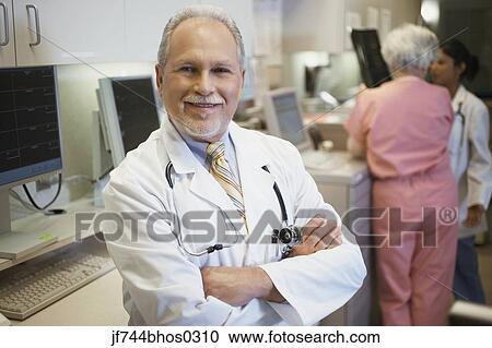 Middle-aged male doctor smiling, Bethesda, Maryland, United States View Large Photo Image Stock Image - Middle-aged male doctor smiling, Bethesda, Maryland, United States. Fotosearch