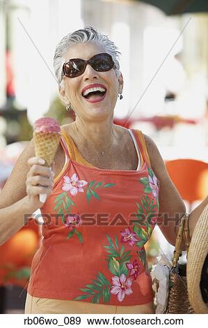 Senior woman with ice cream cone, Miami, Florida, United States View Large Photo Image Stock Photo - Senior woman with ice cream cone, Miami, Florida, United States. Fotosearch