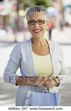 Senior woman with shopping bag, Miami, Florida, United States View Large Photo Image Stock Photo - Senior woman with shopping bag, Miami, Florida, United States. Fotosearch