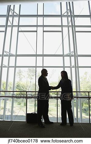Two businesspeople shaking hands, North Bethesda, Maryland, United States View Large Photo Image Stock Photo - Two businesspeople shaking hands, North Bethesda, Maryland, United States. Fotosearch