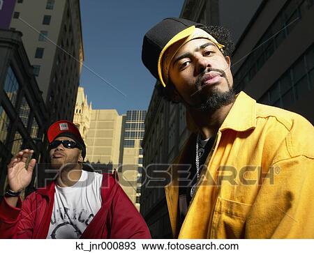 Two young African men standing in urban area, Oakland, California, United States View Large Photo Image Stock Image - Two young African men standing in urban area, Oakland, California, United States. Fotosearch