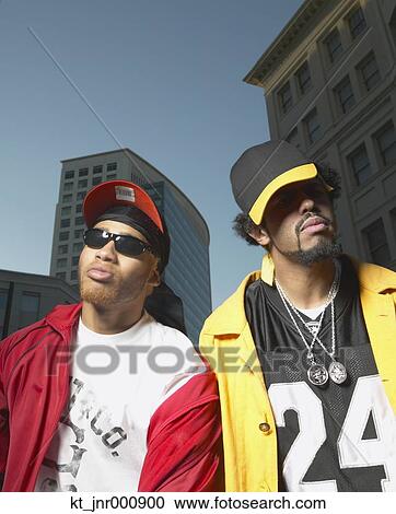 Two young African men standing in urban area, Oakland, California, United States View Large Photo Image Stock Image - Two young African men standing in urban area, Oakland, California, United States. Fotosearch