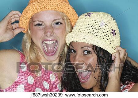 Stock Photo - Two young women laughing. Fotosearch
