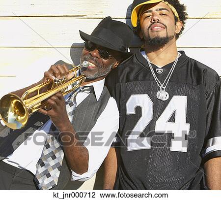 Young African man next to senior African man with trumpet, Oakland, California, United States View Large Photo Image Stock Image - Young African man next to senior African man with trumpet, Oakland, California, United States. Fotosearch