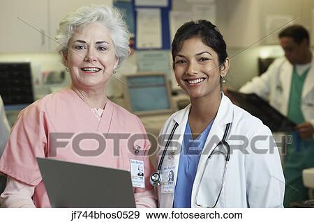 Young Indian female doctor and female nurse, Bethesda, Maryland, United States View Large Photo Image Stock Photo - Young Indian female doctor and female nurse, Bethesda, Maryland, United States. Fotosearch