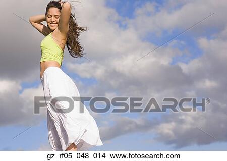 Young woman smiling outdoors View Large Photo Image Picture - Young woman smiling outdoors. Fotosearch