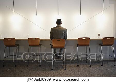 African American businessman sitting in chair View Large Photo Image Stock Photo - African American businessman sitting in chair. Fotosearch