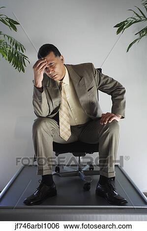 African American businessman sitting in chair on pedestal View Large Photo Image Stock Photograph - African American businessman sitting in chair on pedestal. Fotosearch