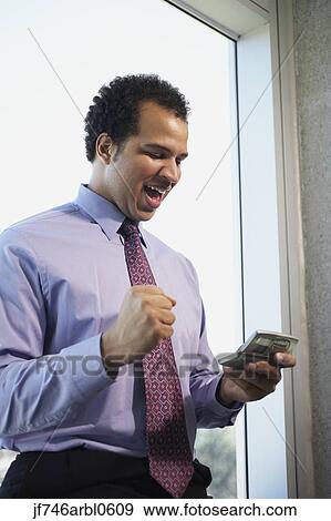 African American businessman using cell phone View Large Photo Image Stock Photo - African American businessman using cell phone. Fotosearch