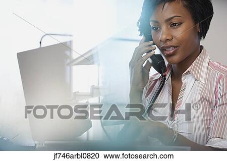 African American businesswoman talking on telephone View Large Photo Image Stock Image - African American businesswoman talking on telephone. Fotosearch