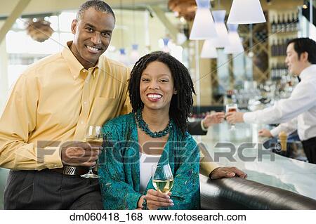 African American couple smiling at bar View Large Photo Image Stock Photo - African American couple smiling at bar. Fotosearch