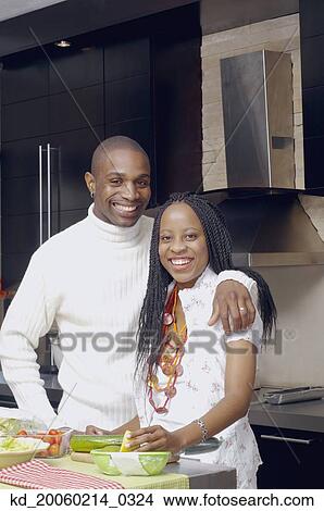 African American couple smiling in kitchen View Large Photo Image Picture - African American couple smiling in kitchen. Fotosearch