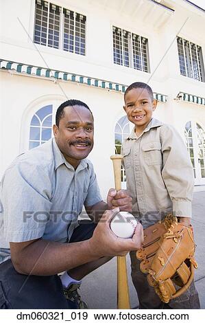 African American father and son with baseball equipment View Large Photo Image Stock Photo - African American father and son with baseball equipment. Fotosearch