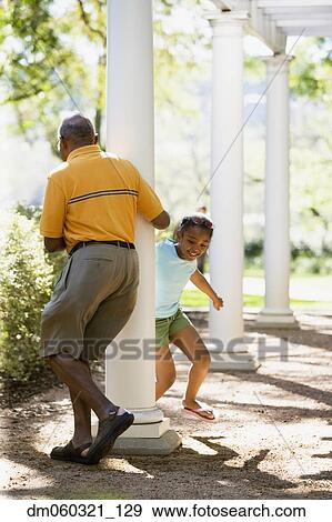 African American grandfather and granddaughter playing outdoors View Large Photo Image Stock Photo - African American grandfather and granddaughter playing outdoors. Fotosearch