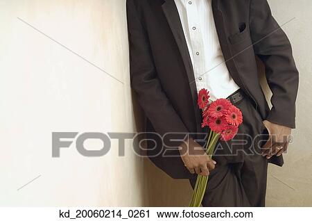 African American man in suit holding flowers View Large Photo Image Stock Image - African American man in suit holding flowers. Fotosearch