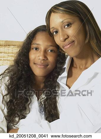 African American mother and daughter hugging View Large Photo Image Stock Image - African American mother and daughter hugging. Fotosearch