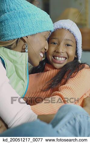 African American mother and daughter hugging View Large Photo Image Stock Photo - African American mother and daughter hugging. Fotosearch